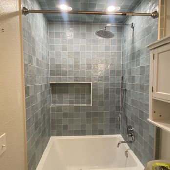 Tub/shower combo remodel with gray tile surround