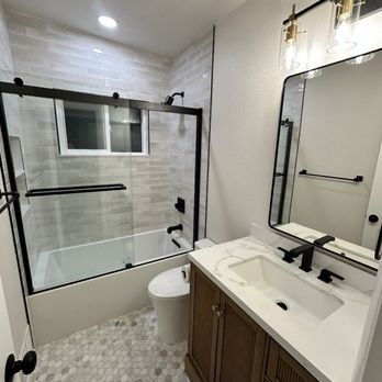 Tub/shower combo remodel with wood vanity