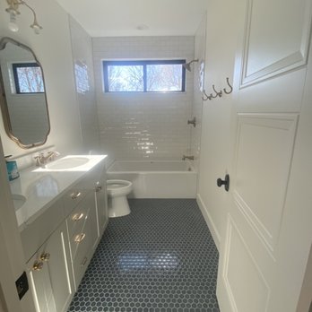 Bathroom remodel with blue tile flooring
